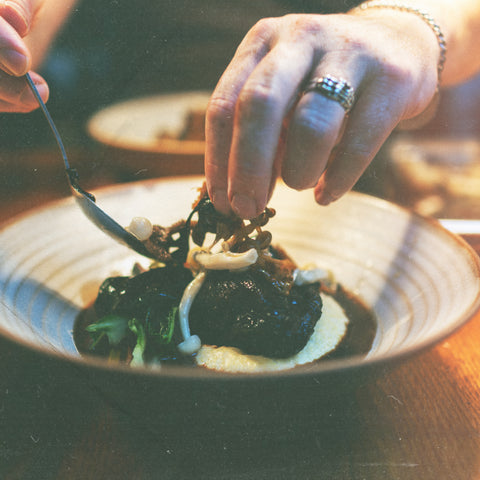Chef prepares a dish to serve in The Green Room