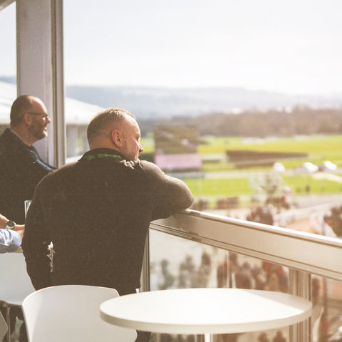 Hospitality guests on the balcony at the Cheltenham Festival